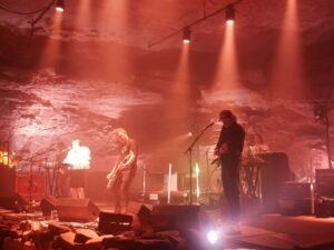 slowdive band playing on stage in cave at the caverns in red light